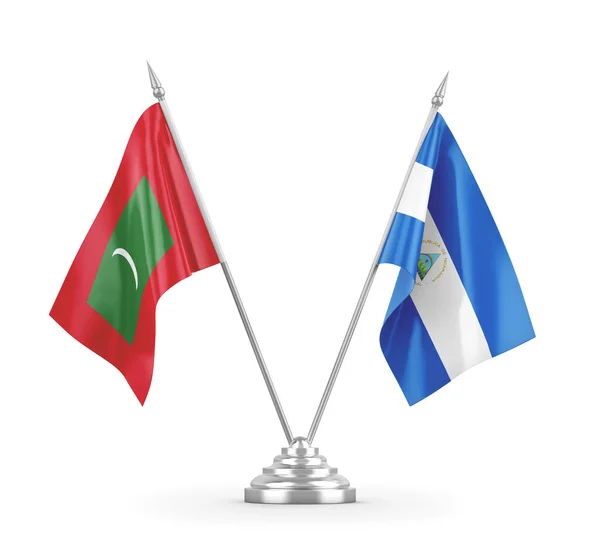 Nicaragua og Maldiverne bordflag isoleret på hvid 3D rendering - Stock-foto