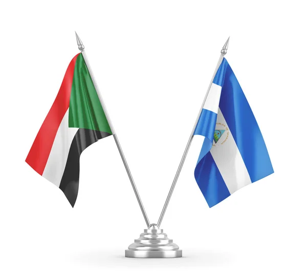 Nicaragua and Sudan table flags isolated on white 3D rendering — Stock Photo, Image