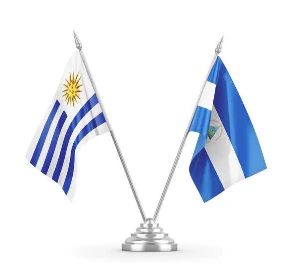 Nicaragua and Uruguay table flags isolated on white 3D rendering — Stock Photo, Image