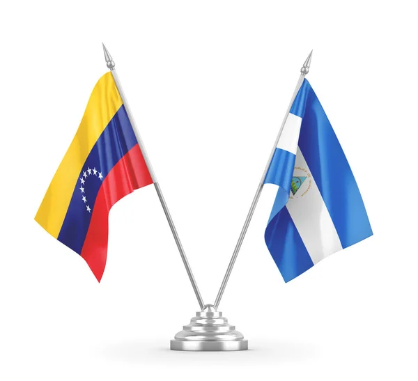 Nicaragua and Venezuela table flags isolated on white 3D rendering — Stock Photo, Image
