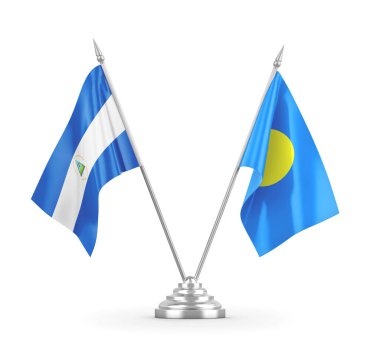 Palau ve Nikaragua masa bayrakları beyaz 3D görüntüleme üzerinde izole edildi