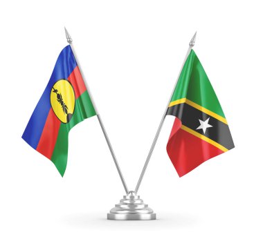 Saint Kitts, Nevis ve Yeni Kaledonya masa bayrakları beyaz üzerine izole edilmiş.