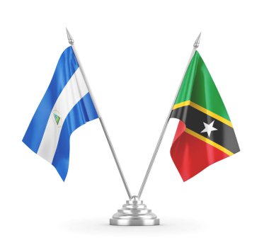 Saint Kitts, Nevis ve Nikaragua masa bayrakları beyaz 3D görüntülerde izole edilmiş.