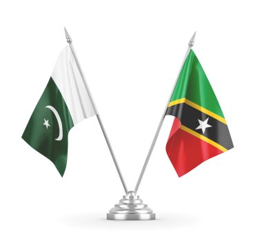 Saint Kitts, Nevis ve Pakistan masa bayrakları beyaz 3D görüntülerde izole edilmiş.