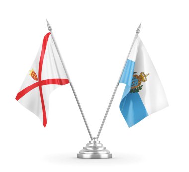 San Marino ve Jersey masa bayrakları beyaz 3D görüntülerde izole edilmiş.