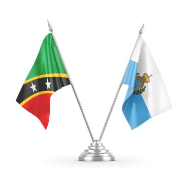 San Marino, Saint Kitts ve Nevis masa bayrakları beyaz 3D görüntülerde izole edilmiş.