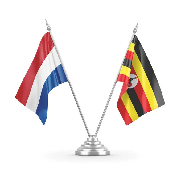 Bandiere da tavolo Uganda e Paesi Bassi isolate su rendering 3D bianco — Foto Stock