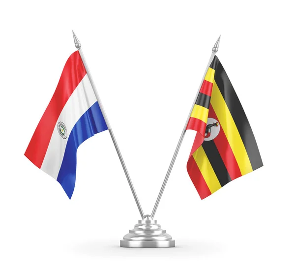 Bandiere da tavolo Uganda e Paraguay isolate su rendering 3D bianco — Foto Stock