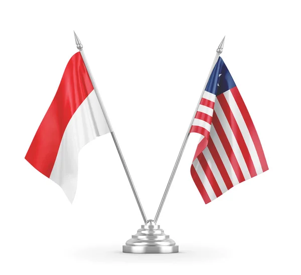 Banderas de mesa Liberia e Indonesia aisladas en renderizado 3D blanco — Foto de Stock