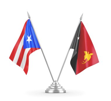 Papua Yeni Gine ve Porto Riko masa bayrakları beyaz 3D görüntüleme üzerinde izole edildi