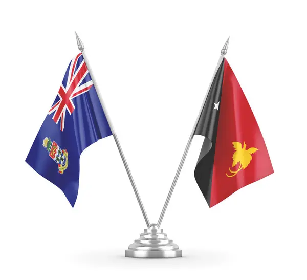 Bandeiras de tabela Papua-Nova Guiné e Ilhas Cayman isoladas em renderização 3D branca — Fotografia de Stock