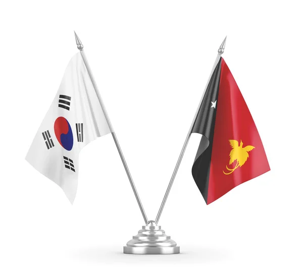 Bandiere da tavolo Papua Nuova Guinea e Corea del Sud isolate su rendering 3D bianco — Foto Stock