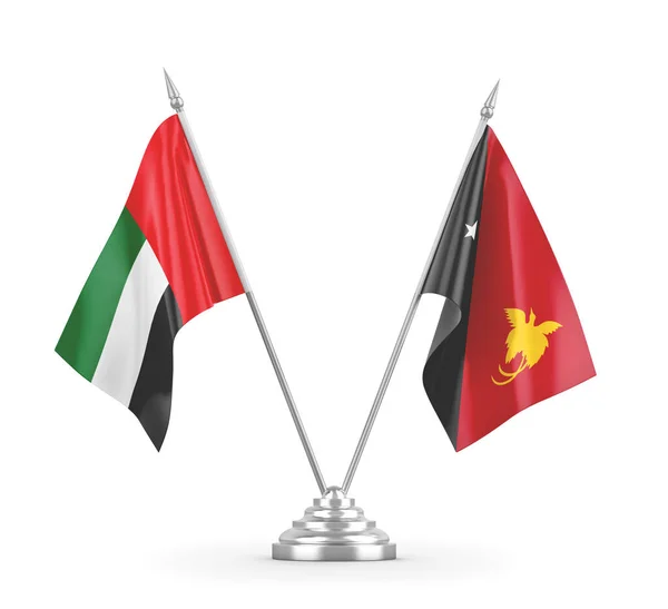 Banderas de mesa de Papúa Nueva Guinea y Emiratos Árabes Unidos aisladas en blanco —  Fotos de Stock