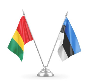 Estonya ve Gine masa bayrakları beyaz 3D görüntüleme üzerinde izole edildi