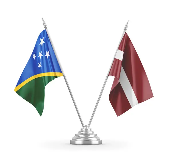 Drapeaux de table Lettonie et Îles Salomon isolés sur un rendu 3D blanc — Photo