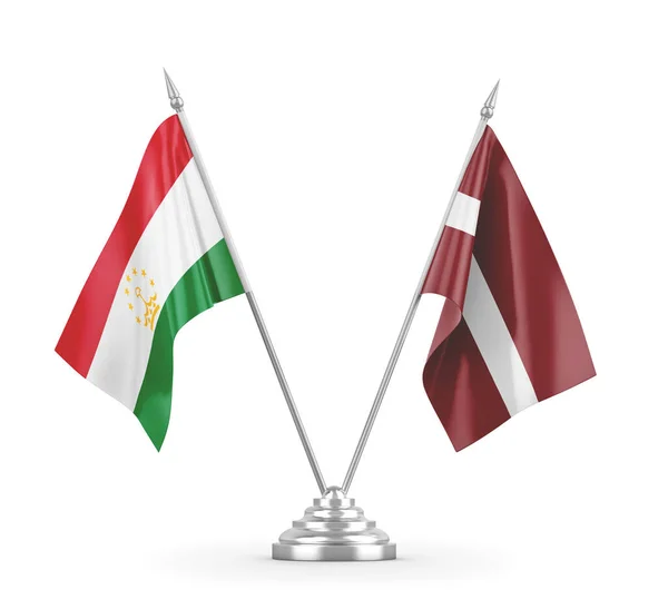 Латвія і Таджикистан настільні прапори ізольовані на білому 3D рендерингу — стокове фото