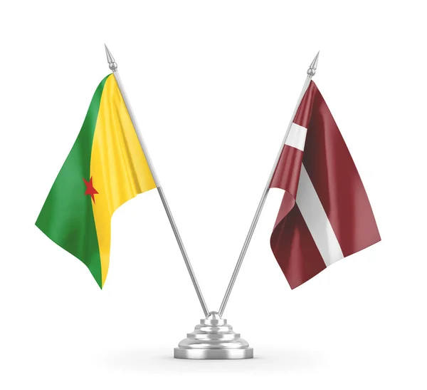 Lotyšsko a Francouzská Guyana tabulky vlajky izolované na bílém 3D vykreslování — Stock fotografie