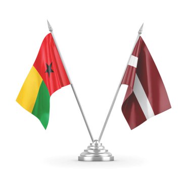 Letonya ve Gine-Bissau masa bayrakları beyaz 3D görüntüleme üzerinde izole edildi