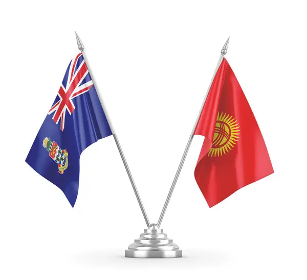 Banderas de mesa de Kirguistán e Islas Caimán aisladas en renderizado 3D blanco — Foto de Stock