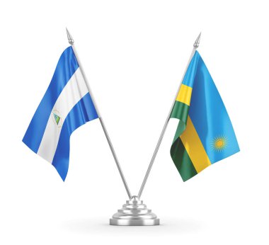 Ruanda ve Nikaragua masa bayrakları beyaz 3D görüntüleme üzerinde izole edildi