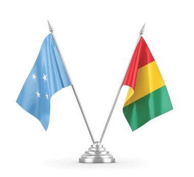 Gine ve Mikronezya masa bayrakları beyaz 3D görüntüleme üzerinde izole