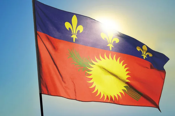 Guadeloupe Flag Waving Wind Front Sun — Stock Photo, Image