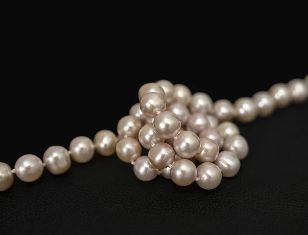 Pearls over black Stock Photo