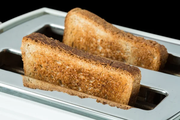 Toasted bread and toaster Stock Photo