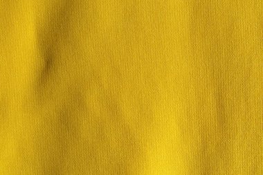 Sarı kumaş kumaş polyester doku ve tekstil arkaplan.