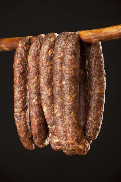 Domestic sausage on a stick — Stock Photo, Image