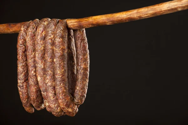 Hanging smoked domestic traditional sausage — Stock Photo, Image