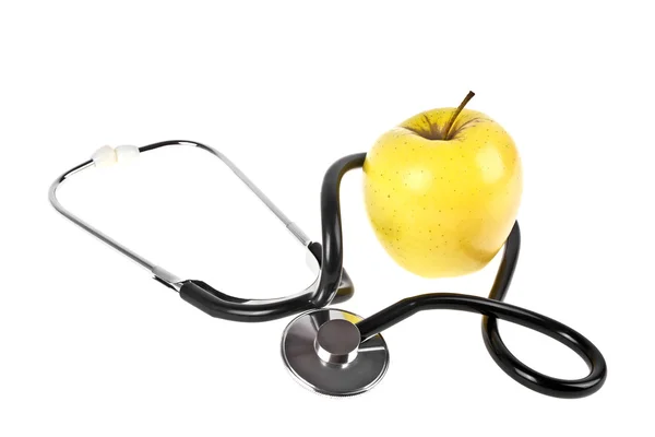Concepto para dieta y salud - manzana amarilla y estetoscopio o — Foto de Stock