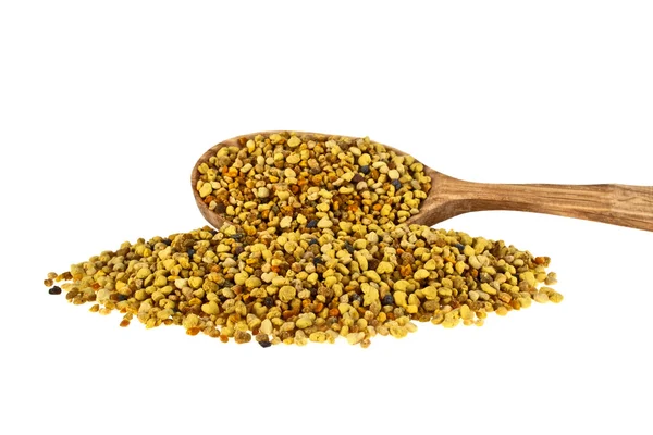 Pile of bee pollen in wooden spoon on a white background — Stock Photo, Image