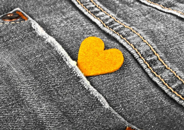 Stock image Yellow heart in jeans pocket