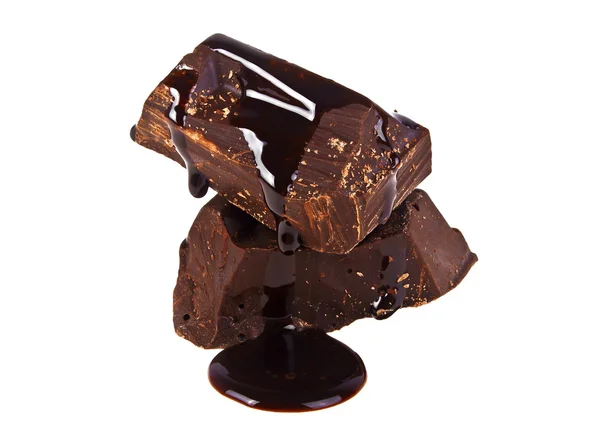 Slices dark chocolate bar poured chocolate isolated on white bac — Stock Photo, Image