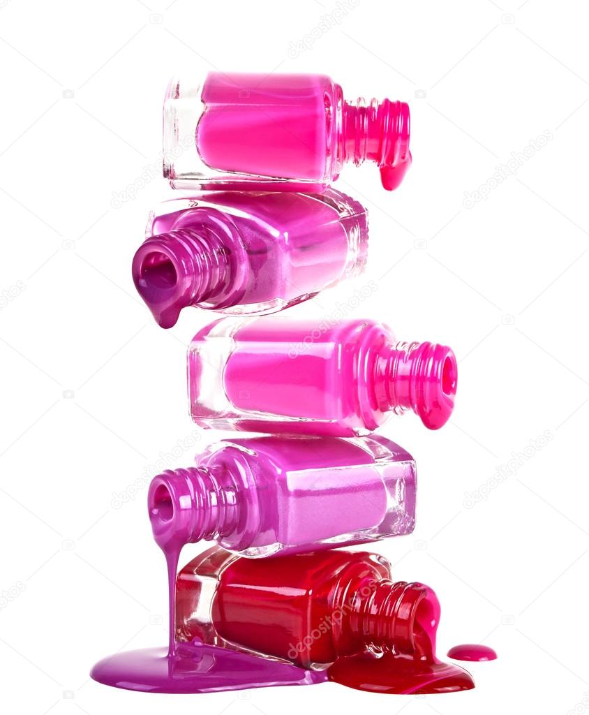 Bottles with spilled nail polish on a white background