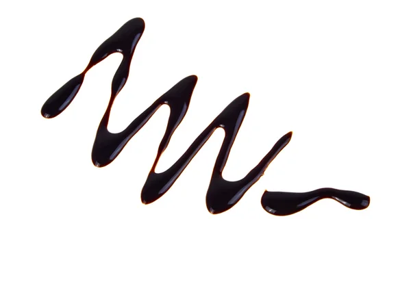 Beyaz arka plan üzerinde dra silüeti izole sıvı çikolata — Stok fotoğraf
