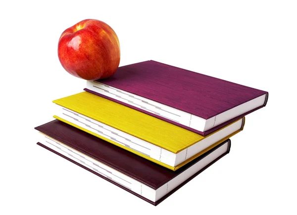 Conceito de educação. Uma maçã vermelha em cima de uma pilha de livros — Fotografia de Stock