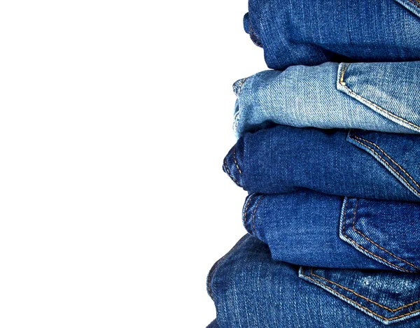 Banyak jeans biru yang berbeda terisolasi pada latar belakang putih — Stok Foto