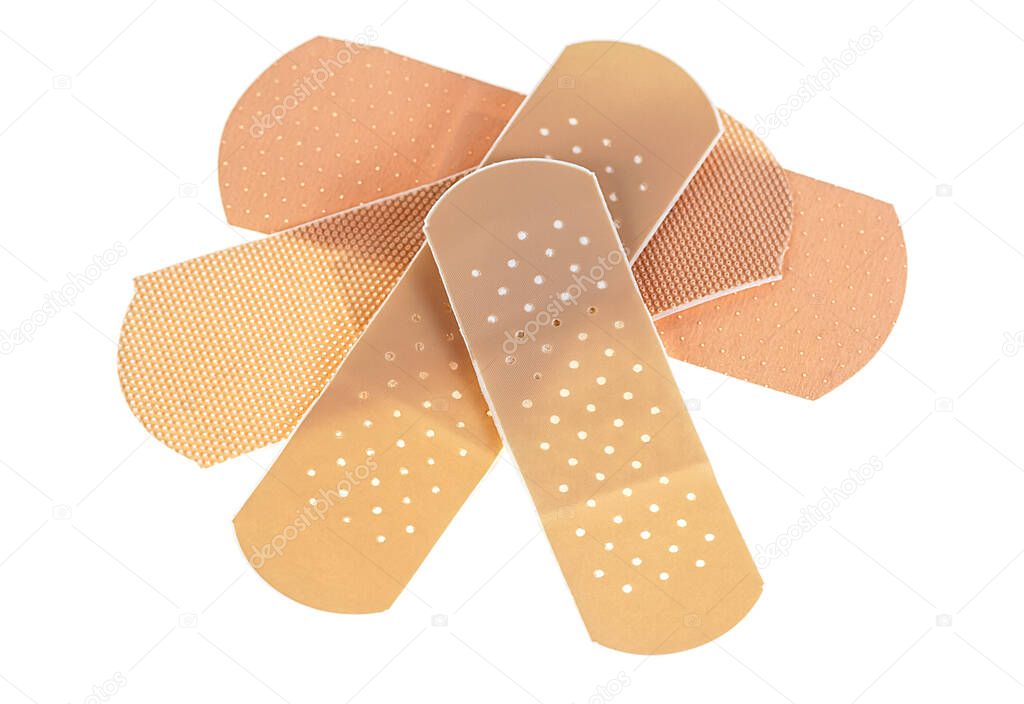 Top view of beige adhesive bandages isolated on a white background. Adhesive plasters.