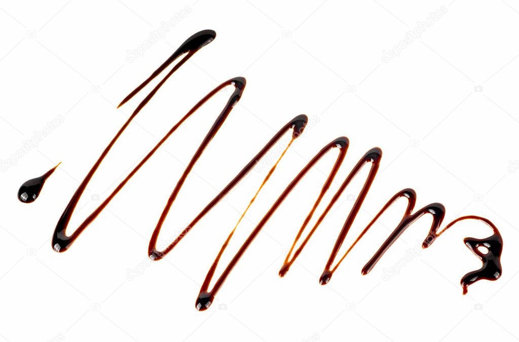 Liquid chocolate isolated on a white background. Abstract pattern made of chocolate.