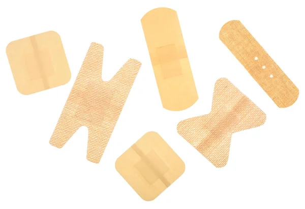 Conjunto Diferentes Bandagens Adesivas Isoladas Fundo Branco Vista Superior Emplastros — Fotografia de Stock