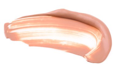 Makyaj temeli, bej kapatıcı kumaş lekesi lekesi beyaz arka planda izole edilmiş. BB-krem.