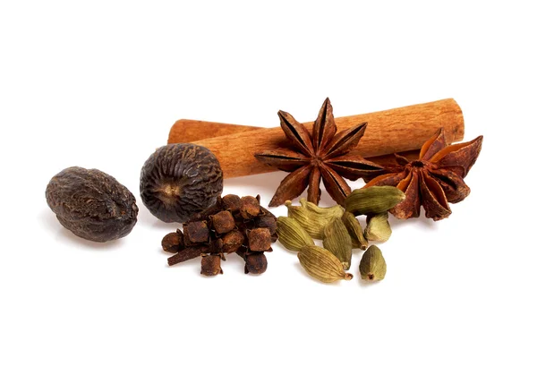 Anise, carnation, cardamom, nutmeg and cinnamon sticks on a whit — Stock Photo, Image