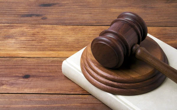 Wooden gavel and book on wooden background — Stock Photo, Image