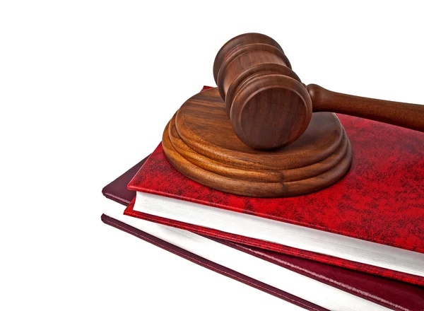 Wooden mallet and books on a white background — Stock Photo, Image