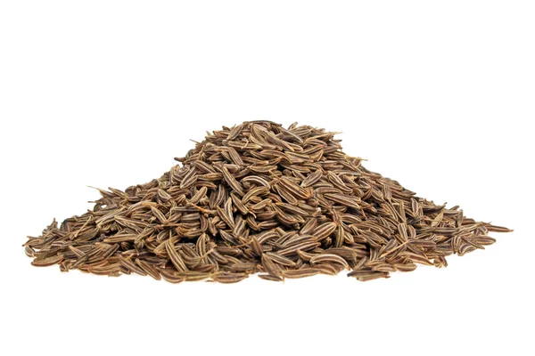 Montón de semillas de comino sobre un fondo blanco — Foto de Stock