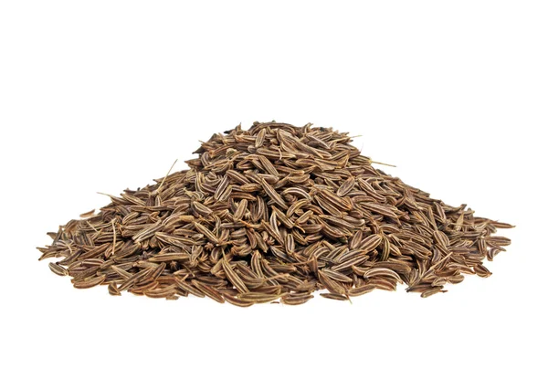 Montón de semillas de comino sobre un fondo blanco — Foto de Stock