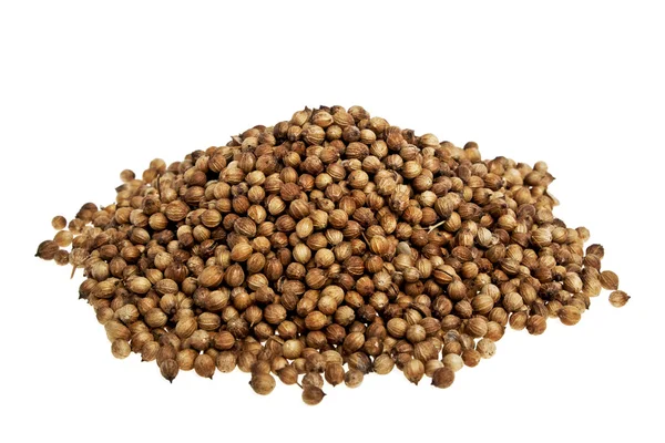 Heap koriander zaden op een witte achtergrond — Stockfoto