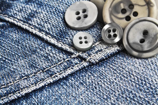 Кнопки на синьому джинсі — стокове фото